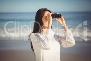 Woman looking through binoculars