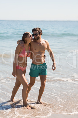 Couple embracing on beach