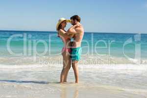 Couple embracing on beach