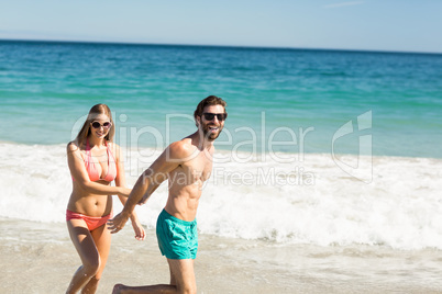 Couple walking on beach