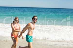 Couple walking on beach