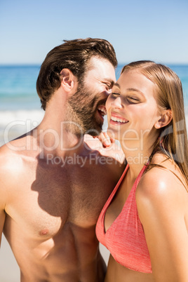 Young man whispering in his partner ear