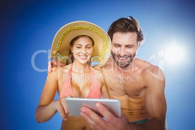 Couple using mobile phone on a sunny day Couple using mobile phone on a sunny day