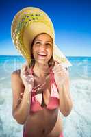 Happy woman posing on beach