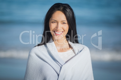 Young woman standing on beach