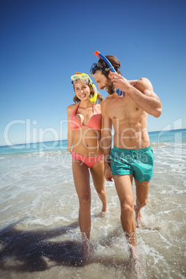 Couple running in water