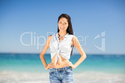 Young woman standing on beach