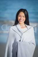 Young woman standing on beach