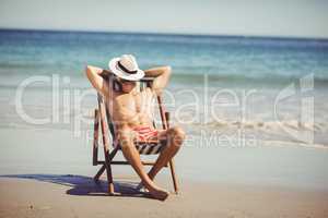 Man relaxing on armchair