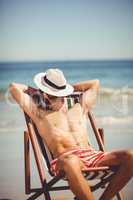 Man relaxing on armchair