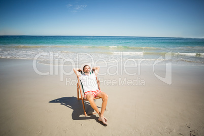 Man relaxing on armchair