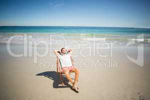 Man relaxing on armchair