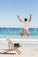 Man jumping on beach