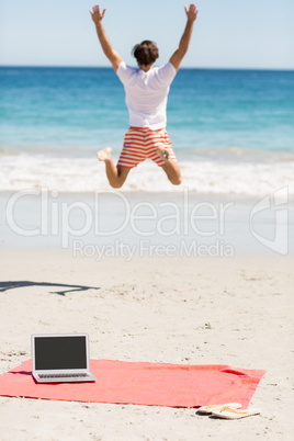 Man jumping on beach