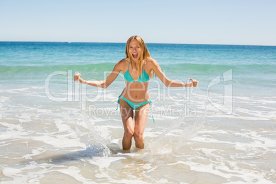 Young woman playing in water