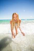 Young woman playing in water