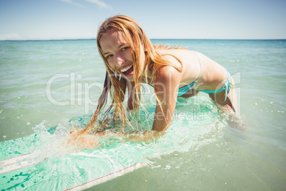 Woman surfing in sea