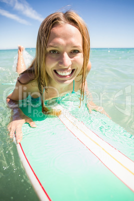 Woman surfing in sea