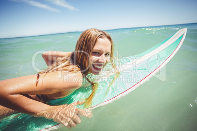 Woman surfing in sea