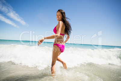 Woman running in water