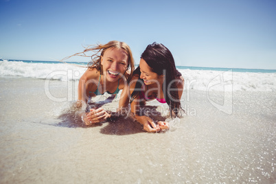 Female friends enjoying on beach