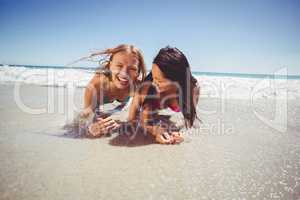 Female friends enjoying on beach