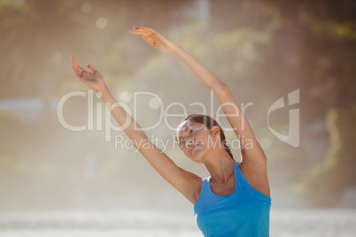 Woman exercising on beach