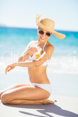 Woman applying sunscreen on her hand