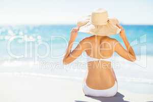 Woman taking sunbath on beach