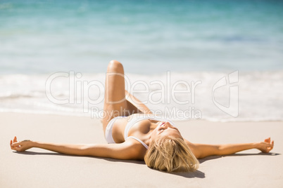 Woman sunbathing on beach