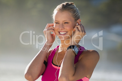 Woman listening music on headphone