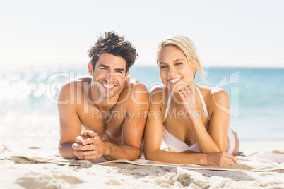 Young couple lying on beach