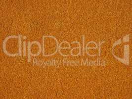 Orange artificial synthetic grass meadow background