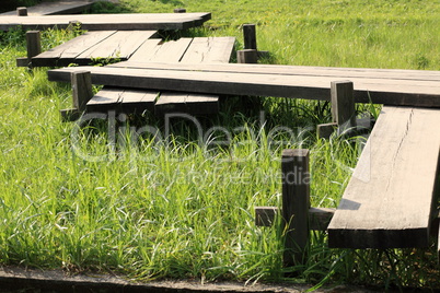 wood bridge in japan garden at day