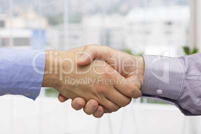 Composite image of handshake