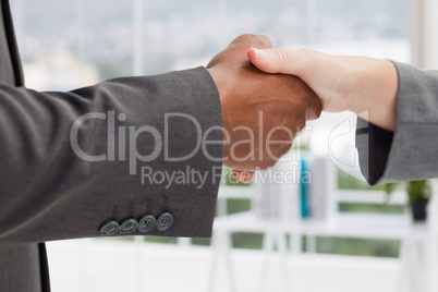 Composite image of handshake