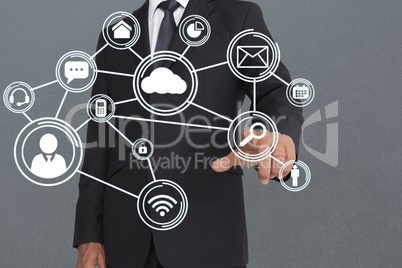 Composite image of businessman is touching a screen