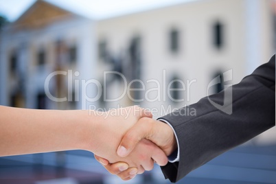 Composite image of a handshake