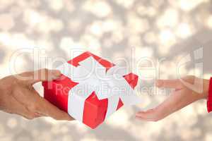 Composite image of a man is giving a gift to a woman