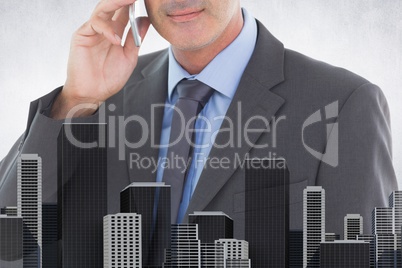 Composite image of businessman is talking on the phone