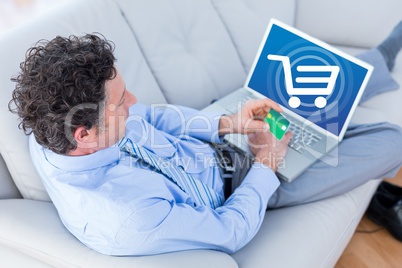 Composite image of businessman is buying online