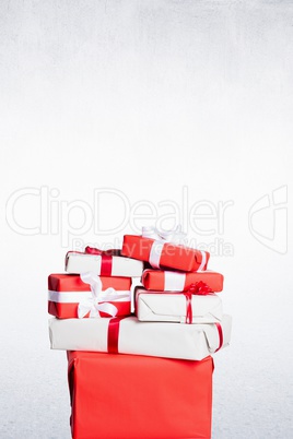 Composite image of Christmas gifts are piling