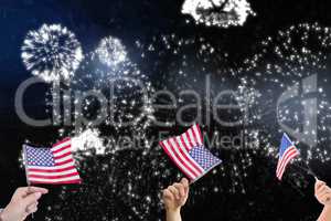 Composite image of hands is shaking american flags