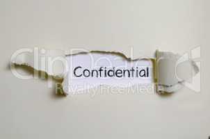 The word confidential appearing behind torn paper.