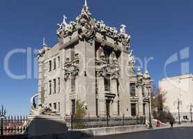 chimera house with stone gargoyle, demons, monsters on its roof and decoration gothic style photo