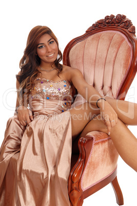 Young woman sitting in armchair.