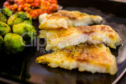 White fish pangasius with brussels sprouts
