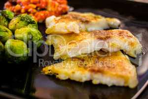 White fish pangasius with brussels sprouts