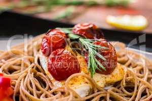 Chicken with rosemary, tomato and spaghetti