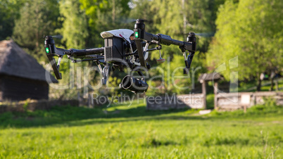 Flying drone is filming in the countryside